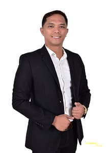 alt="Portrait of Alexis Pilares, smiling against a plain white background"