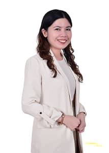 alt="Portrait of Iris Gueco, smiling against a plain white background"